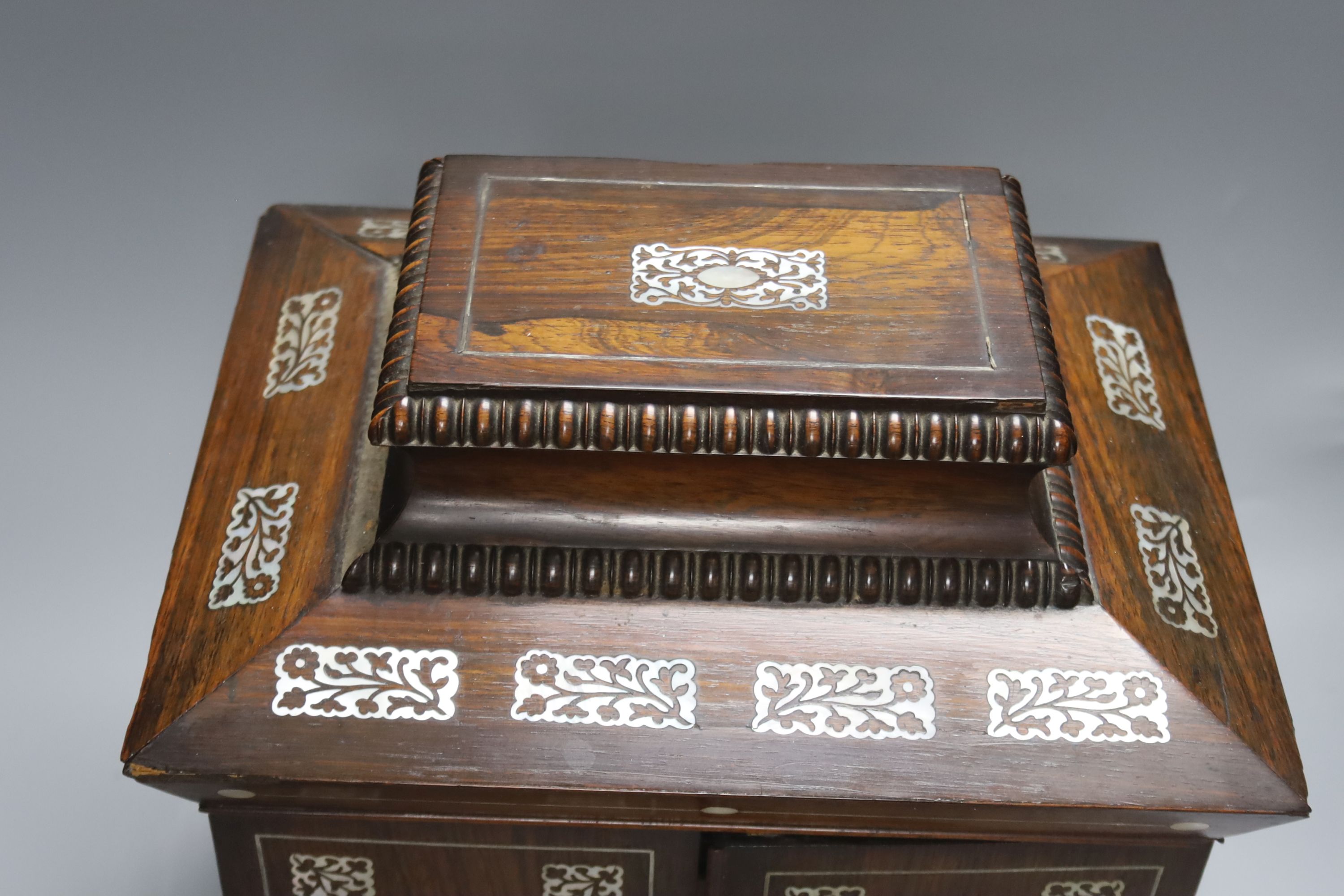 A William IV mother of pearl inset rosewood work box, height 36cm, containing mother-of-pearl and ivory items